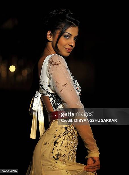 Bollywood actor Mugdha Godse present the creation of designer Swapnil Shinde, during the first day of the Bangalore Fashion Week in Bangalore on...