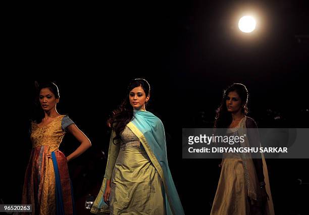 Models present creations by designer Lakshmi Jagmohan during the second day of the Bangalore Fashion Week in Bangalore on January 29, 2010. 30...