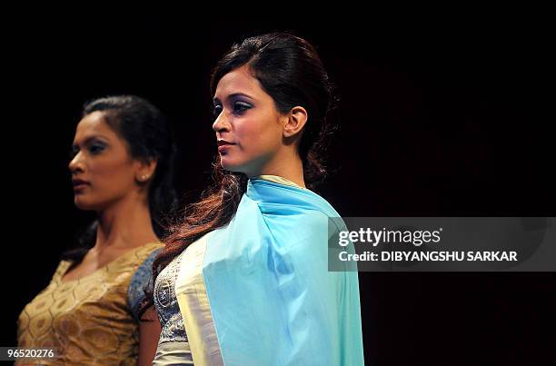 Models present creations by designer Lakshmi Jagmohan during the second day of the Bangalore Fashion Week in Bangalore on January 29, 2010. 30...