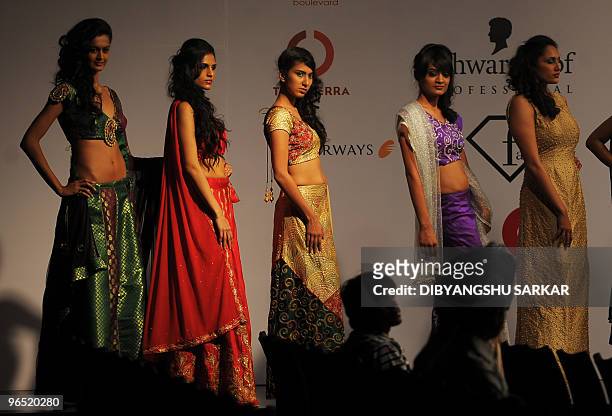 Models present creations by designer Lakshmi Jagmohan during the second day of the Bangalore Fashion Week in Bangalore on January 29, 2010. 30...