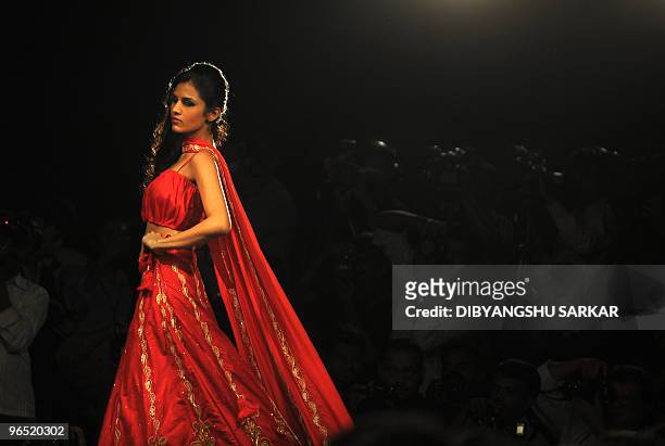 An Indian model presents a creation by designer Lakshmi Jagmohan during the second day of the Bangalore Fashion Week in Bangalore on January 29,...