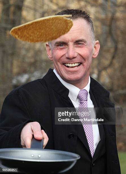 Gary Rhodes flipping pancakes at a photocall for the annual charity Parliamentary Pancake Race at Victoria Tower Gardens on February 9, 2010 in...