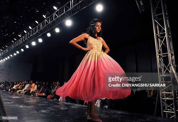 An Indian model walks the ramp as she presents the creation of designer Preeti Chandra, during the second day of the Bangalore Fashion Week in...
