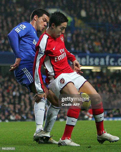 Michael Ballack of Chelsea and Samir Nasri of Arsenal battle for the ball during the English Premiership football match Chelsea vs Arsenal at...