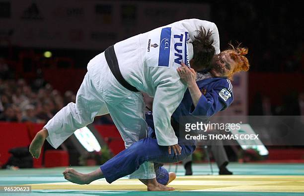 Russian Elena Ivashchenko competes with Tunisian Nihel Chikhrouhou during their women final round fight in the +78kg category, at the Paris judo...