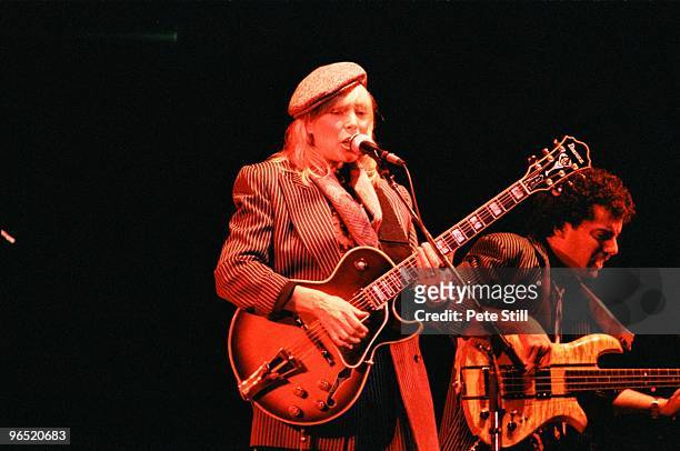 Joni Mitchell performs on stage accompanied by bassist husband Larry Klein, at Wembley Arena on April 23rd, 1983 in London, United Kingdom.