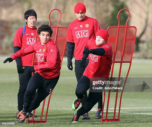 Fabio Da Silva and Wayne Rooney of Manchester United in action during a First Team Training Session at Carrington Training Ground on February 9 2010...