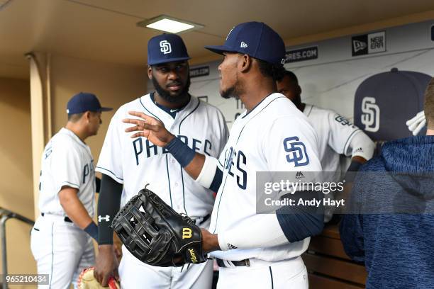 Franmil Reyes talks with Franchy Cordero of the San Diego Padres prior to the game against the Colorado Rockies at PETCO Park on May 14, 2018 in San...