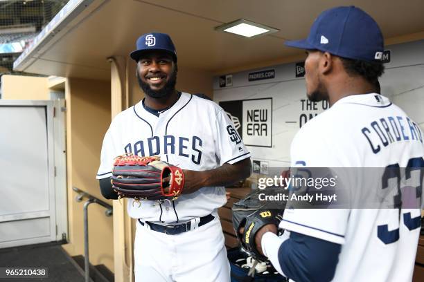 Franmil Reyes talks with Franchy Cordero of the San Diego Padres prior to the game against the Colorado Rockies at PETCO Park on May 14, 2018 in San...