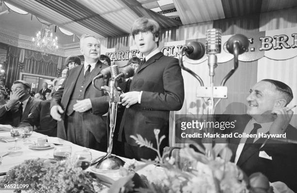 John Lennon of the Beatles with British Labour Leader of the Opposition Harold Wilson at the Variety Club of Great Britain Annual Show Business...