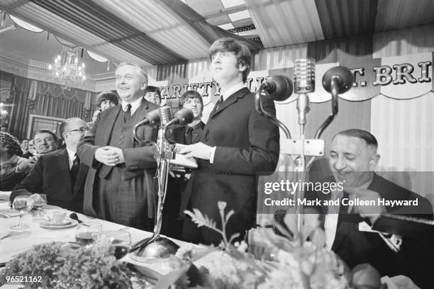 John Lennon of the Beatles with British Labour Leader of the Opposition Harold Wilson at the Variety Club of Great Britain Annual Show Business...