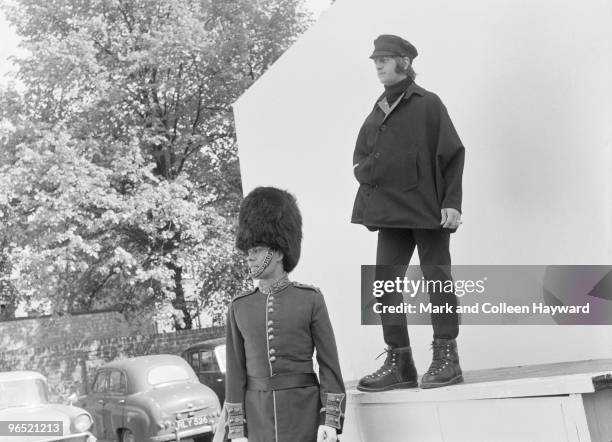 Ringo Starr of the Beatles with actor Victor Spinetti at Twickenham Studios, London, during a photo-shoot to complete the cover of the Beatles' album...