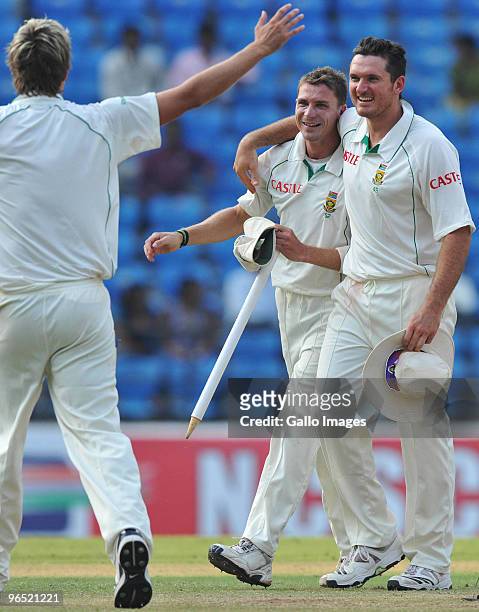 Dale Steyn and Graeme Smith of South Africa celebrate winning by an innings and 6 runsduring day 4 of the 1st test between India and South Africa at...