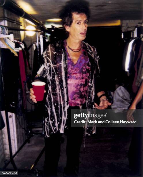 Rolling Stone Keith Richards checks with designer Suzi Stokes that she is happy with his outfit before a televised peformance at the Paradisio Club,...