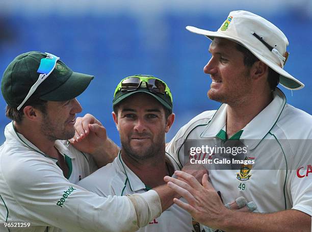 De Villiers, Mark Boucher and Graeme Smith of South Africa celebrate as they walk off after winning by an innings and 6 runsduring day 4 of the 1st...