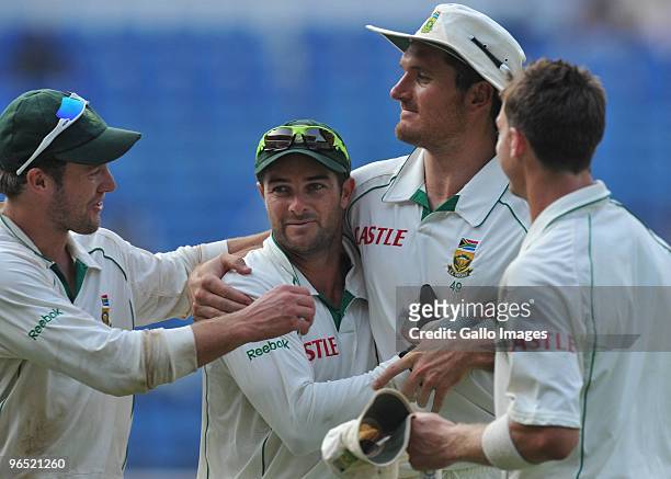 De Villiers, Mark Boucher, Graeme Smith and Dale Steyn of South Africa celebrate as they walk off after winning by an innings and 6 runsduring day 4...