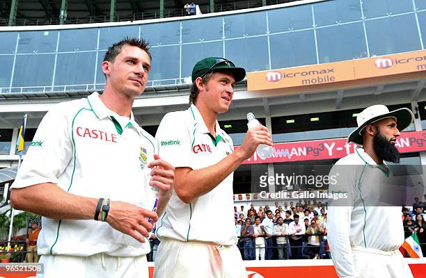 Dale Steyn, Paul Harris and Hashim Amla of South Africa leave the field after winning by an innings and 6 runs on day 4 of the 1st test between India...