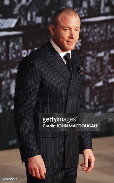 British director Guy Ritchie poses for photographers prior to the German premiere of the film Sherlock Holmes in Berlin January 12, 2010. The film's...