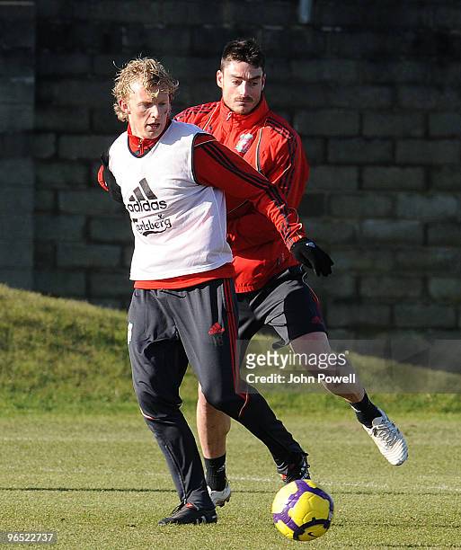 Dirk Kuyt holds off Albert Riera during a team training session at the club's Melwood training ground on February 9, 2010 in Liverpool, England.