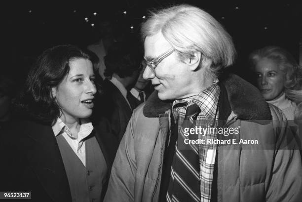 Andy Warhol talks to Fran Lebowitz at a party in New York in 1977