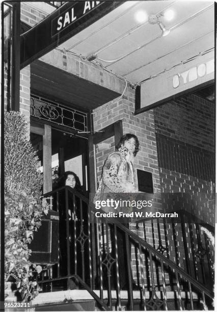 British musician John Lennon and his wife Japanese-born American artist and musician Yoko Ono leave Sal Anthony's Restaurant, New York, New York,...