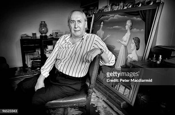 English author J. G. Ballard at home in Shepperton, 30th August 2000. The painting behind him is a copy of 'The Violation' by Paul Delvaux,...