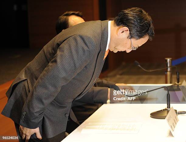Japan's auto giant Toyota Motor president Akio Toyoda bows during a press conference at the company's Nagoya office in Aichi prefecture, central...