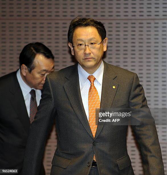Japan's auto giant Toyota Motor president Akio Toyoda enters at a conference room to speak before the press at the company's Nagoya office in Aichi...