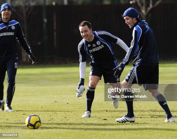 John Terry and Yury Zhirkov of Chelsea during a training session at the Cobham Training ground on February 9, 2010 in Cobham, England.