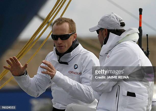 Oracle's owner Larry Ellison and Oracle's Australia's helmsman James Spithill sail at Valencia's harbour on February 09, 2010. A lack of wind led...