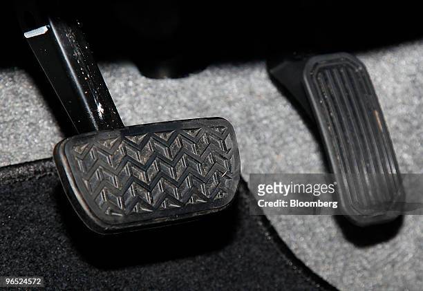 The brake and accelerator pedals of a third-generation Toyota Prius automobile are seen at a dealership in Berlin, Germany, on Tuesday, Feb. 9, 2010....
