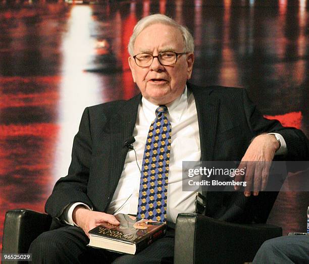 Warren Buffett, chairman and chief executive officer of Berkshire Hathaway Inc., speaks during a book promotion event with former U.S. Treasury...