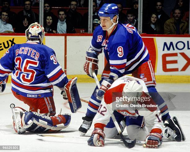 Adam Graves of the New York Rangers skates against Mike Keane of the Montreal Canadiens in the 1990's at the Montreal Forum in Montreal, Quebec,...