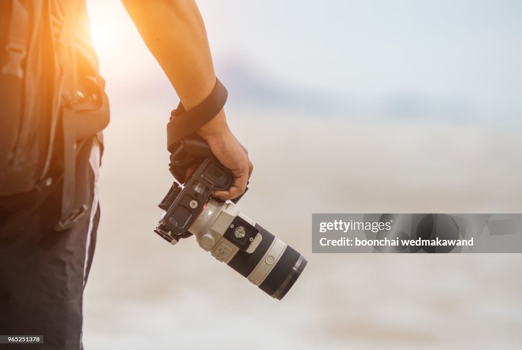 Photographer is holding a camera