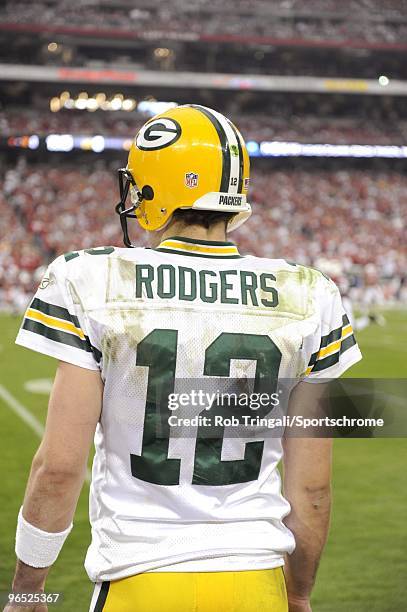 Aaron Rodgers of the Green Bay Packers looks on from the sidelines against the Arizona Cardinals in the NFC wild-card playoff game at University of...