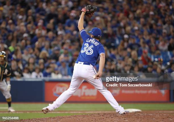Tyler Clippard of the Toronto Blue Jays delivers a pitch in the eighth inning during MLB game action against the Oakland Athletics at Rogers Centre...