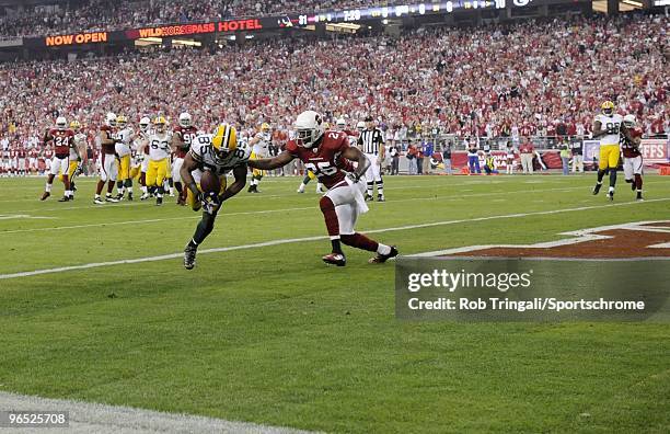 Greg Jennings of the Green Bay Packers scores a touchdown in the third quarter against the Arizona Cardinals in the NFC wild-card playoff game at...