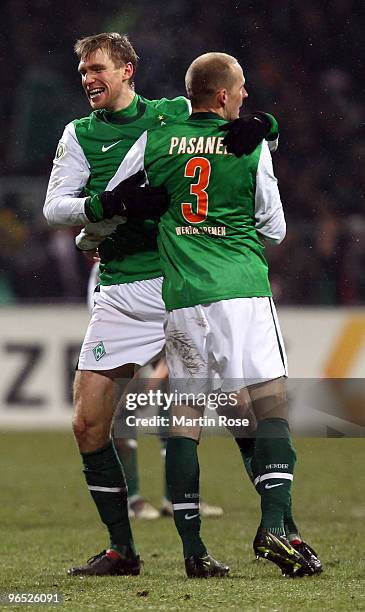 Per Mertesacker of Bremen celebrate with team mate Petri Pasanen after the DFB Cup quarter final match between SV Werder Bremen and 1899 Hoffenheim...