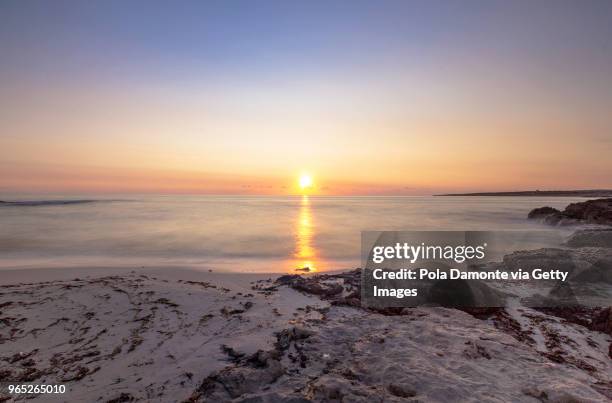 es pujols beach in formentera at dawn balearic islands, spain - pola damonte stock pictures, royalty-free photos & images