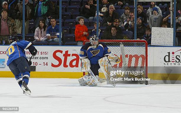 Andy McDonald and goalie Ty Conklin of the St. Louis Blues warm up before the game against the Detroit Red Wings on February 9, 2010 at Scottrade...