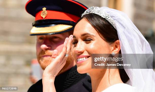 Prince Harry, Duke of Sussex and Meghan, Duchess of Sussex leave Windsor Castle in the Ascot Landau carriage during the procession after getting...