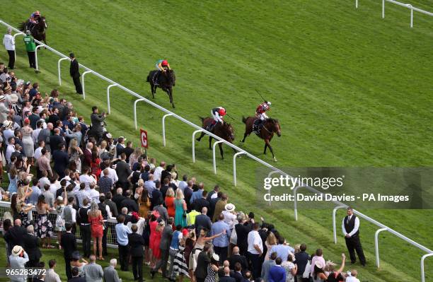 Cracksman ridden by Frankie Dettori gets up to beat Salouen ridden by Silvestre De Sousa in the Investec Coronation Cup during ladies day of the 2018...