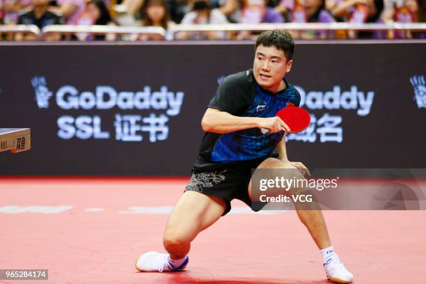 Liang Jingkun of China competes in the Men's Singles eighth-final match against Timo Boll of German during day two of the 2018 ITTF World Tour China...