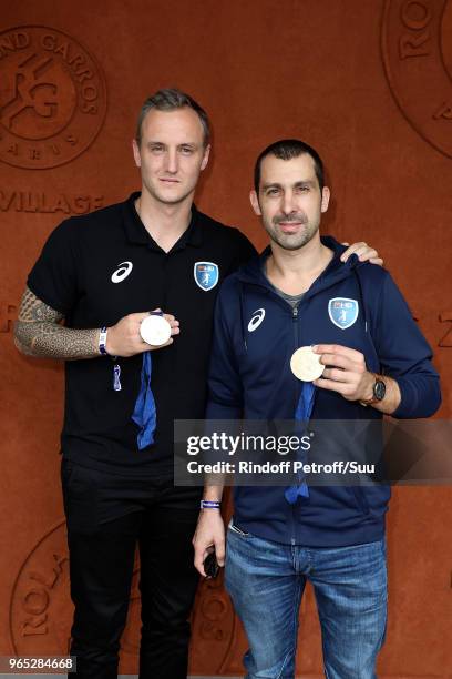 Handball players Valentin Porte and Michael Guigou attend the 2018 French Open - Day Six at Roland Garros on June 1, 2018 in Paris, France.