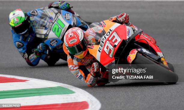 Repsol Honda's Spanish rider Marc Marquez and EG 0,0 Marc VDS' Italian rider Franco Morbidelli take a curve during a free practice session ahead of...