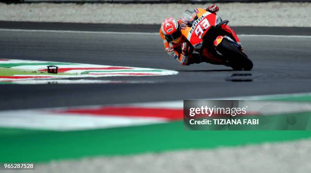 Repsol Honda's Spanish rider Marc Marquez takes a curve during a free practice session ahead of the Italian MotoGP Grand Prix at the Mugello...