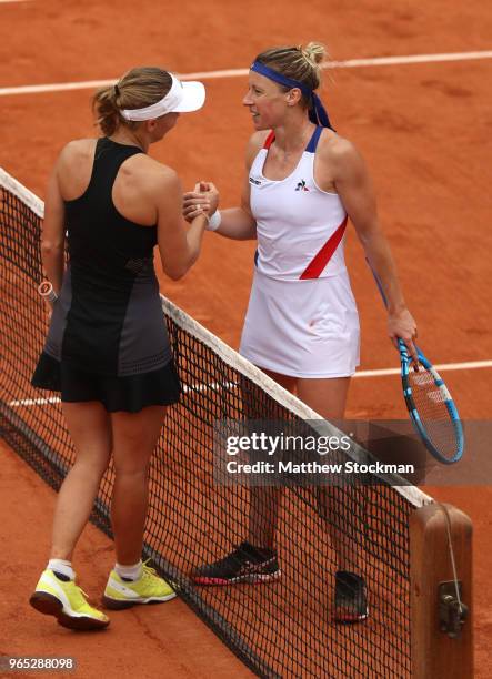 Caroline Wozniacki of is congratulated on victory by Pauline Parmentier of France following their ladies singles third round match during day six of...