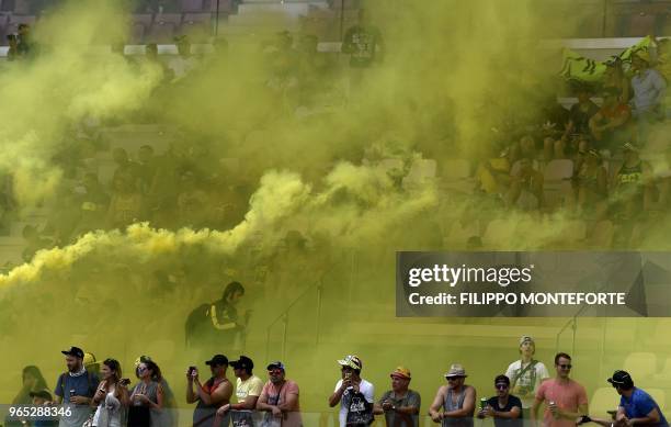 MotoGP fans attend a free practice session ahead of the Italian MotoGP Grand Prix at the Mugello racetrack in Scarperia e San Piero, on June 1, 2018.