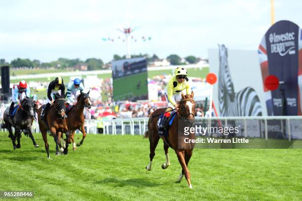 Andrea Atzeni riding Ajman King wins the Investec Wealth & Investment Handicap during Ladies Day of the Investec Derby Festival at Epsom Downs on...