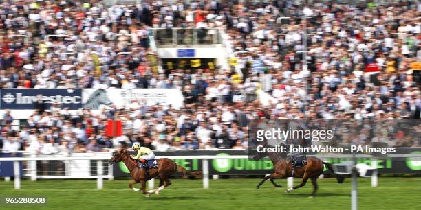 Ajman King ridden by Jockey Andrea Atzeni on the way to winning the Investec Wealth & Investment Handicap during ladies day of the 2018 Investec...